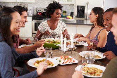 Group Of Friends Enjoying Dinner Party At Home