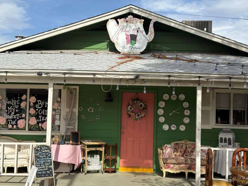 Exterior of The Pink Door Tea House with its charming pink entrance and vintage décor accents, photographed on Mother’s Day